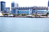 A US Coast Guard ship and the SSV Niagara in front of the Cleveland Browns Stadium